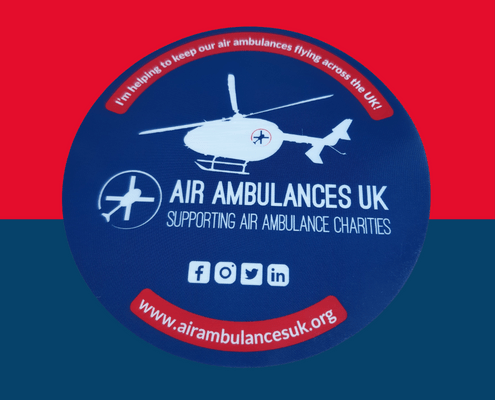 Sticker that promotes Air Ambulances UK with a red and blue background.