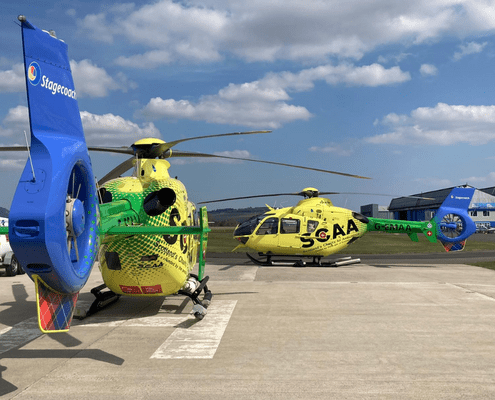 Two of Scotland's Air Ambulance helicopters stationary