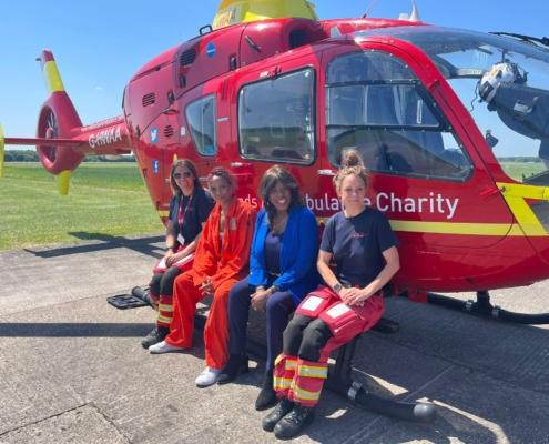 Jaki Graham pictured with the Midlands Air Ambulance Helicopter