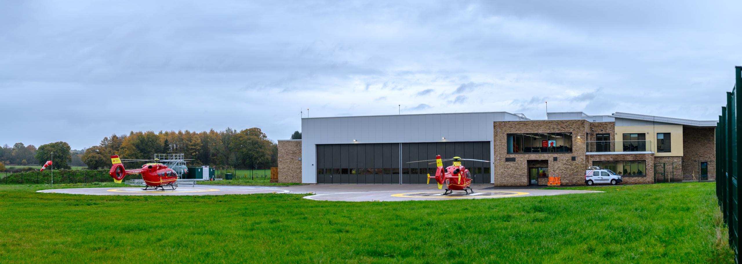 Helicopters on landing pads at Midlands Air Ambulance New Airbase
