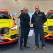 Rob Hughes Halls Electrical handing over the converted Hybrid RRVs to Scott McIlwaine at EHAAT