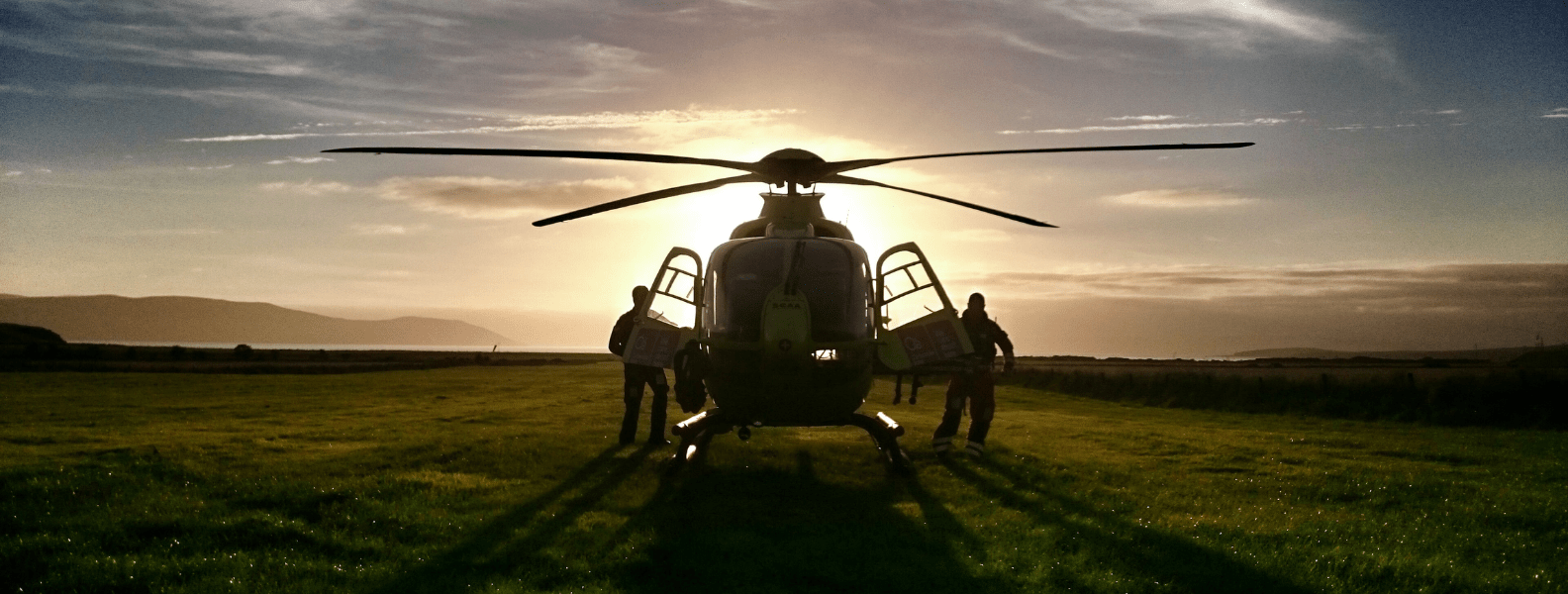 Helicopter at dusk with crew